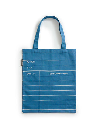 A blue canvas tote bag with white printed lines and text fields for borrowing and date due tracking, shown against a plain white background.