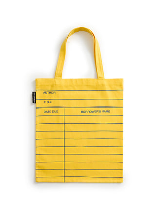 A yellow canvas tote bag with lined sections, featuring fields for author, title, date due, and borrower's name, shown on a white background.