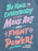 A close-up of a blue fabric surface printed with colorful hand-lettered text reading 'Be Kind to Everybody, Make Art and Fight the Power! -Colson Whitehead'.