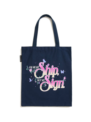 A navy blue canvas tote bag with long handles, featuring a decorative graphic on the front that reads 'ASK ME MY Ship NOT MY Sign' in pink and white script with pastel butterflies, shown against a plain white background.