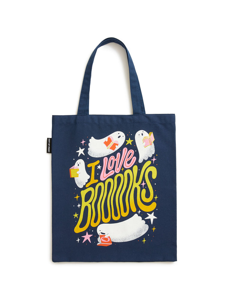 A navy blue canvas tote bag featuring a colorful graphic print with cartoon ghosts, stars, and the text 'I Love BOOKS' in yellow and pink, shown against a plain white background.