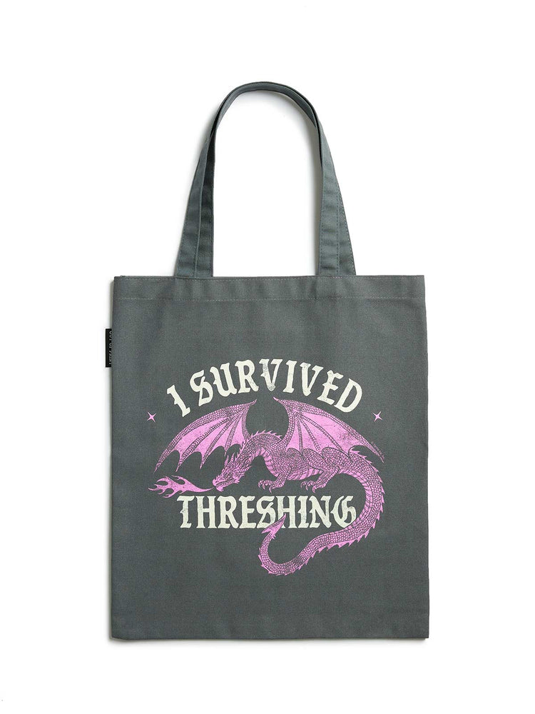 Gray tote bag with pink dragon design and text on a white background