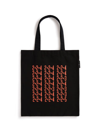 A black canvas tote bag with two black shoulder straps, featuring a grid of red mathematical equations (such as 2+2=4) printed on the front. The bag is photographed flat against a clean white background.