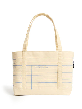 A cream-colored canvas tote bag with blue lined notebook-style writing guides and two shoulder straps, shown on a plain white background.