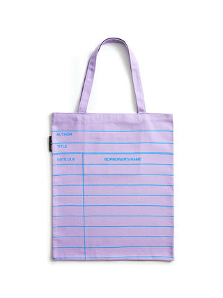 A lilac purple tote bag with blue horizontal lines and printed writing fields, shown against a plain white background.
