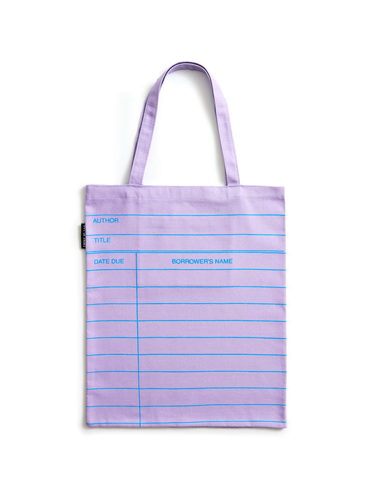 A lilac purple tote bag with blue horizontal lines and printed writing fields, shown against a plain white background.