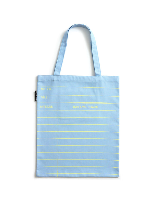 A light cloud blue canvas tote bag with yellow horizontal lines and yellow text, featuring two shoulder straps, photographed against a plain white background.