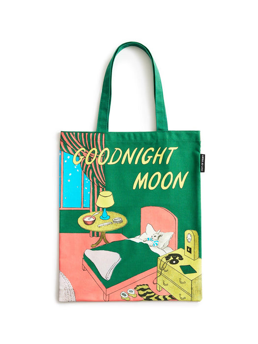 A green canvas tote bag with 'GOODNIGHT MOON' printed in yellow text, featuring a whimsical illustration of a bedroom scene with a cat on a bed.