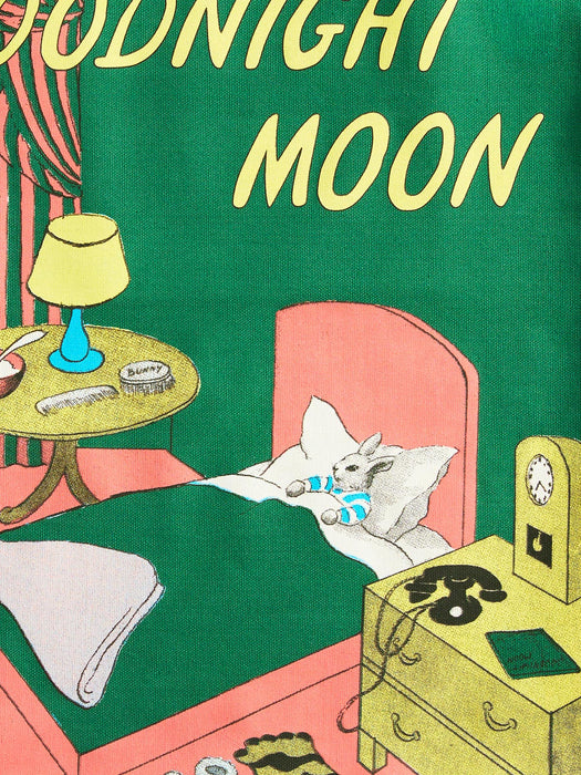 Vintage-style illustrated book or album cover reading 'Goodnight Moon' in large yellow letters over a green background, showing a bedroom scene with a bed, lamp, nightstand, telephone, and a rabbit in bed.