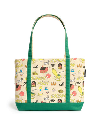 A canvas tote bag with a cream-colored body covered in a whimsical 'Goodnight Moon' pattern, featuring green handles and a green bottom base, set against a plain white background.