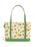 A canvas tote bag featuring a cream background printed with green frogs, white flowers, and small yellow stars, accented with solid green handles and bottom trim.