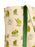 A close-up of a canvas tote bag featuring a whimsical print of green frogs, white flowers, and small yellow dots on a cream background, with a solid green fabric strap.