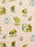 A repeating pattern of whimsical illustrated frogs in green and yellow tones, white flowers, and small grassy tufts on a warm beige background.