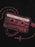 A close-up of a black garment featuring a red graphic print of a cassette tape with a rosary chain and cross, with the text 'Interview with the Vampire' and 'A Novel by Anne Rice'.