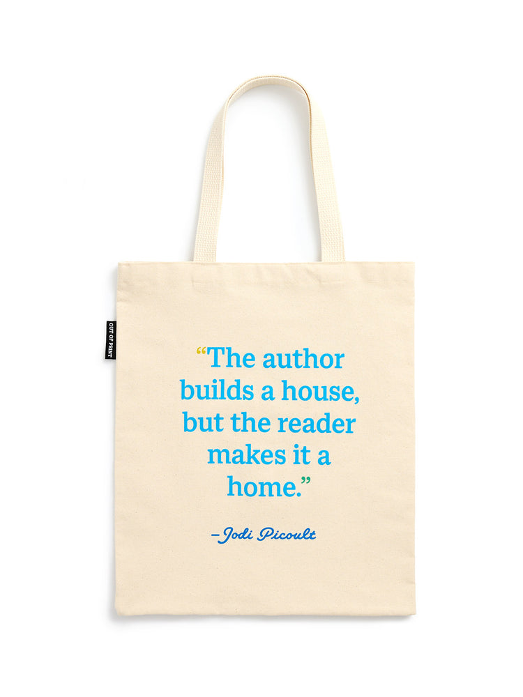 A cream-colored canvas tote bag with a blue quote printed on the front, featuring two shoulder straps and a small black brand tag on the left side.
