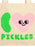 A beige canvas tote bag featuring a graphic design with a green pickle, a pink heart with a face, and the word 'PICKLES' in green letters.