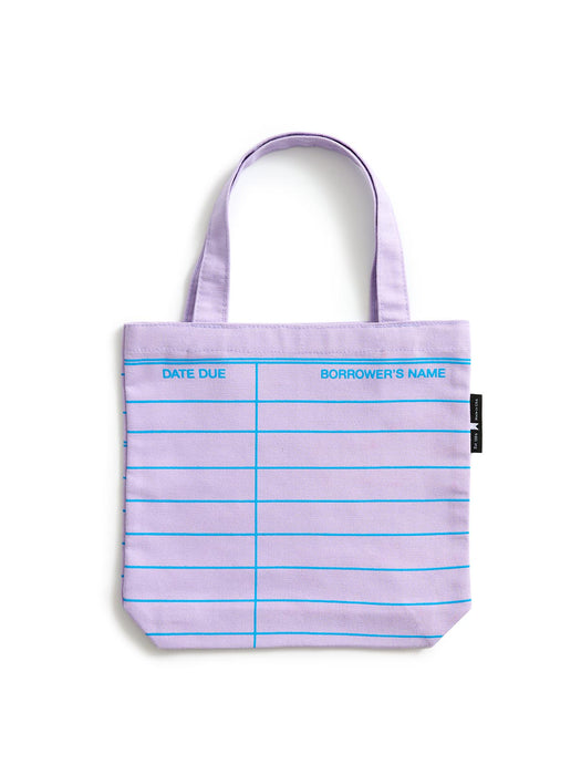 A lilac purple tote bag with blue printed lines and text fields for 'DATE DUE' and 'BORROWER'S NAME', shown on a clean white background.