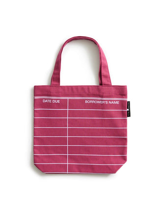 A maroon red canvas tote bag with white horizontal lines and columns, featuring the headers 'DATE DUE' and 'BORROWER'S NAME' printed in white. The bag has two top handles and a small black tag on the right side.