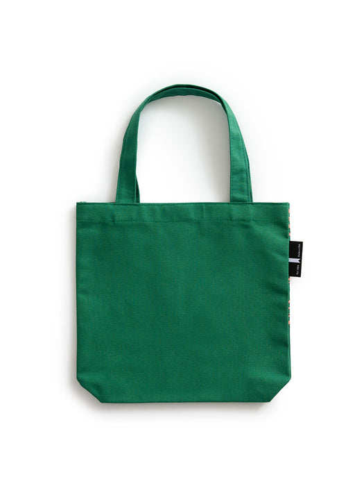 A green canvas tote bag with two top handles and a small black side tag, photographed against a plain white background.