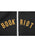 Close-up of a black zip-up garment with the words 'BOOK RIOT' embroidered in yellow across both sides of a white zipper.